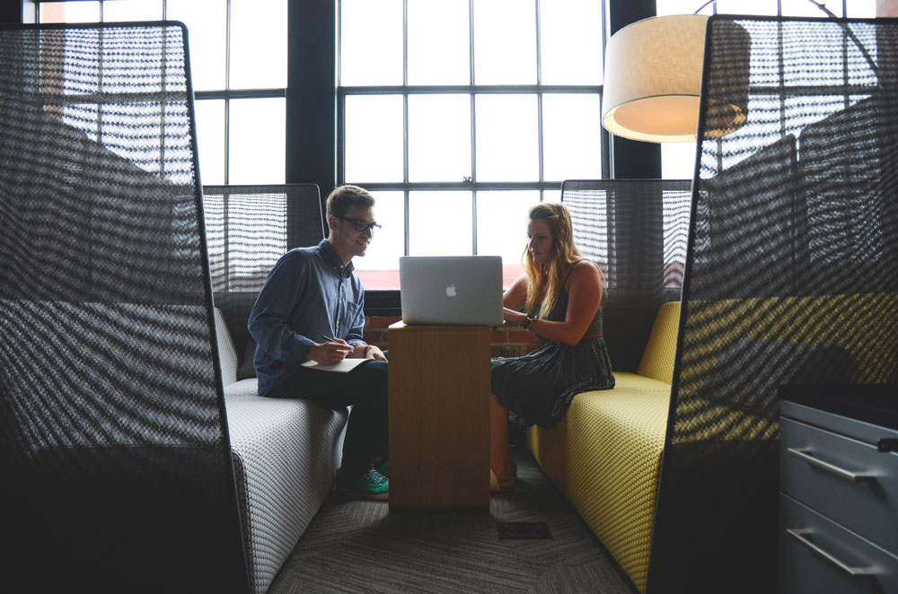 Two people having a meeting in a modern-looking officespace