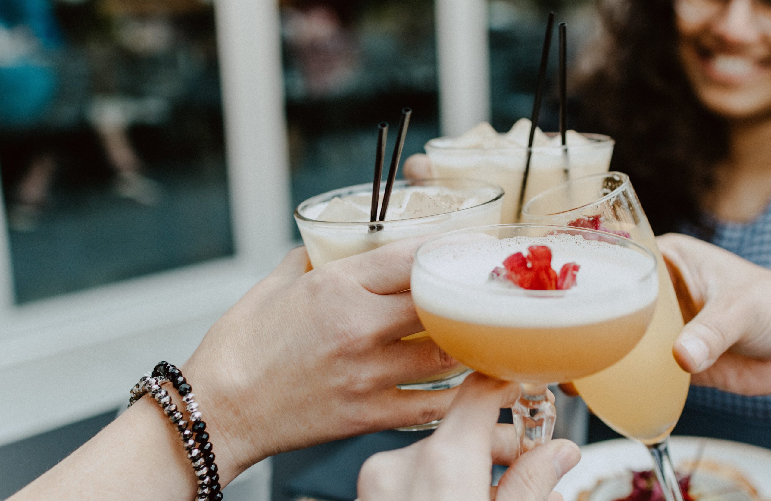 People toasting cocktails