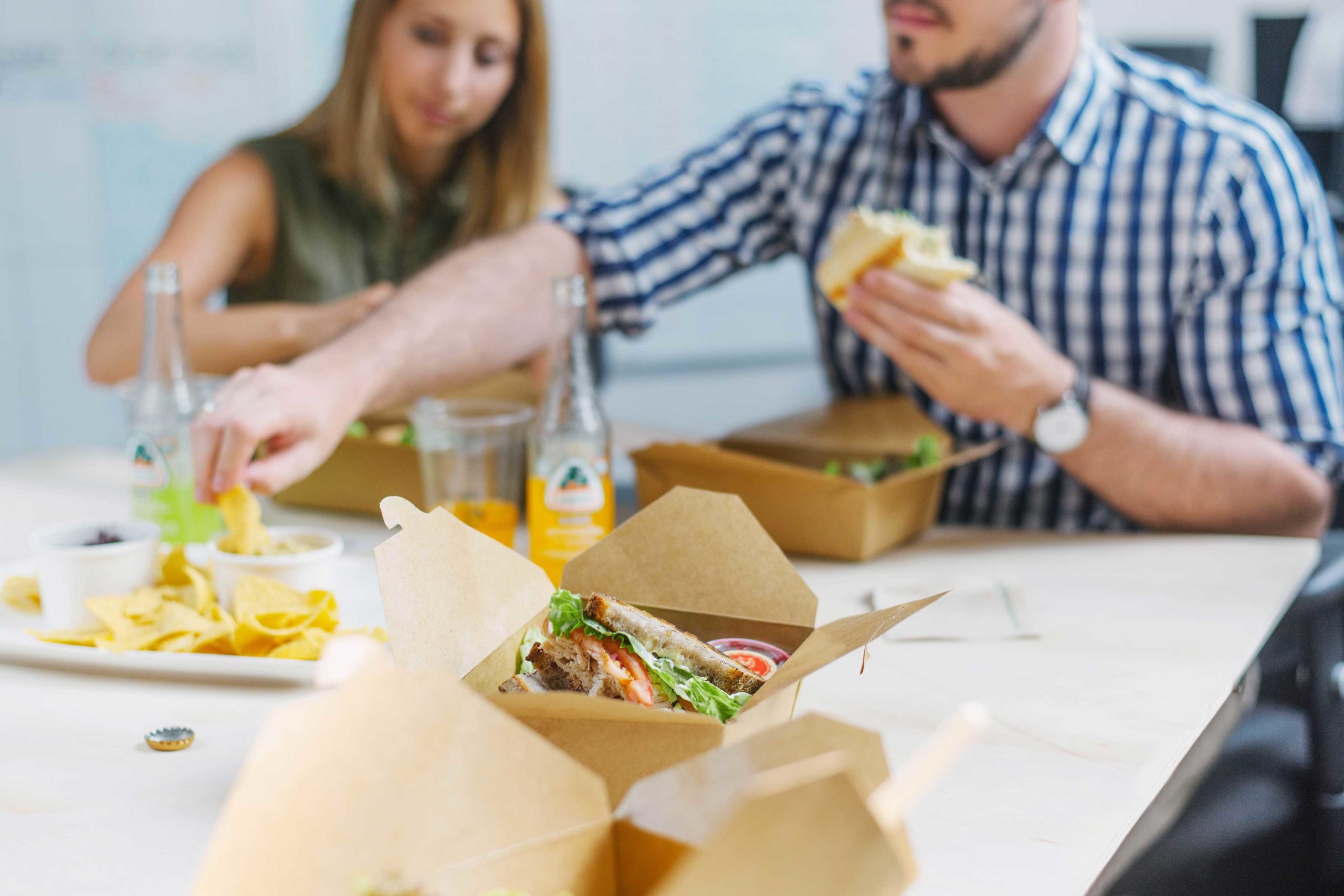 Employees eating office lunch