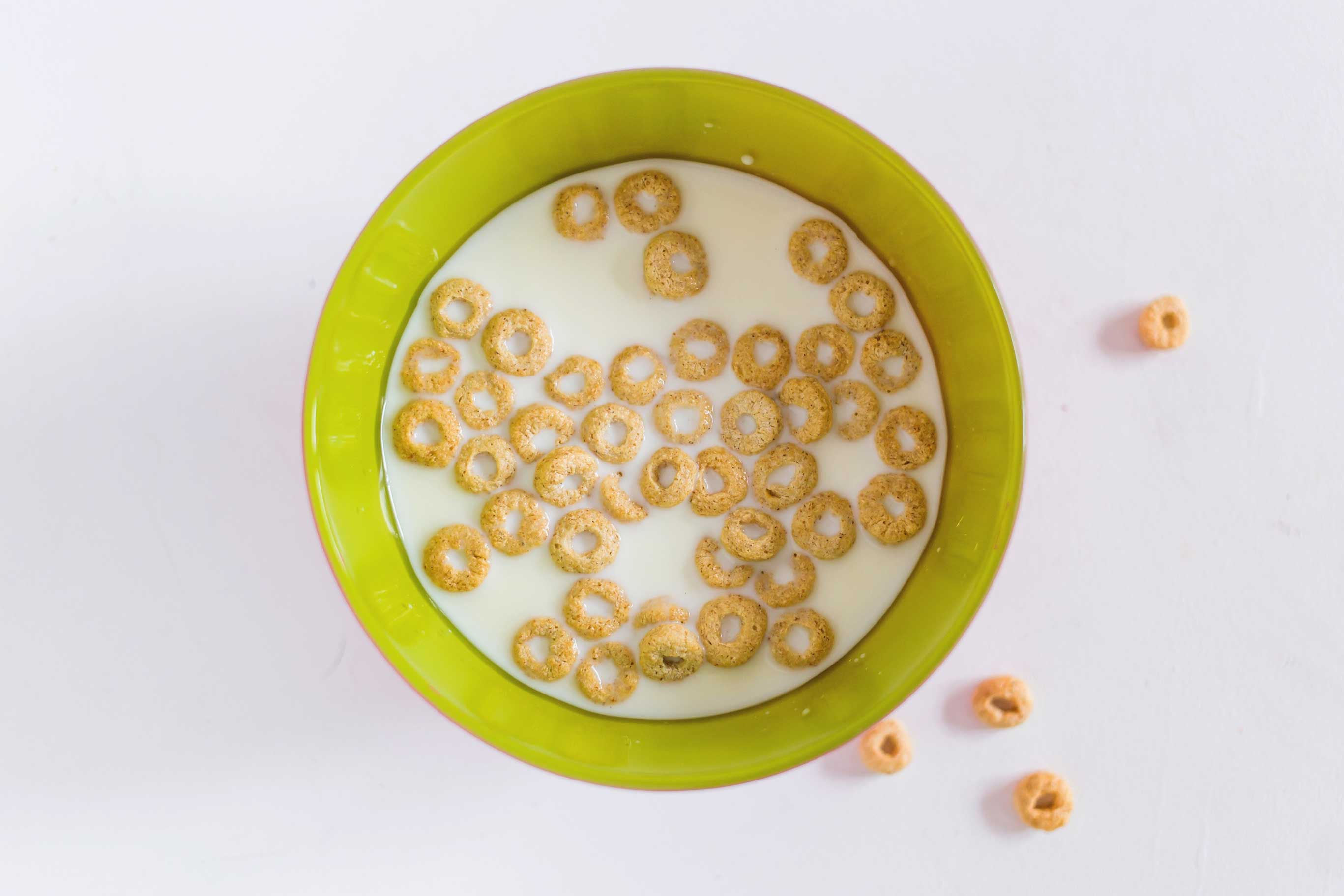 Hemp milk and cheerios in a bowl