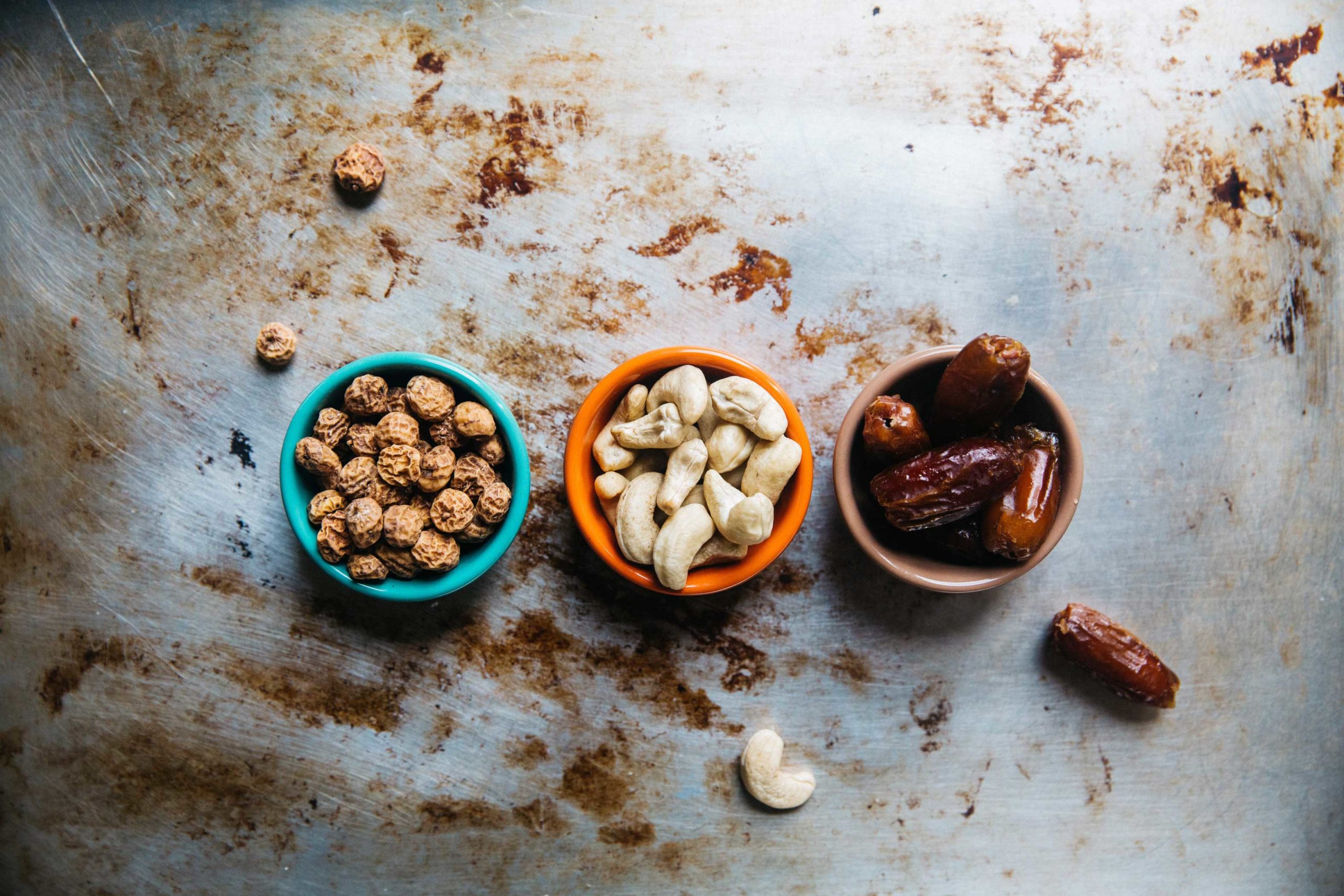 Nuts and dried fruits in three little bowls