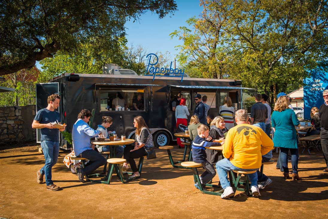 Picnic area and food truck at Austin's Paperboy