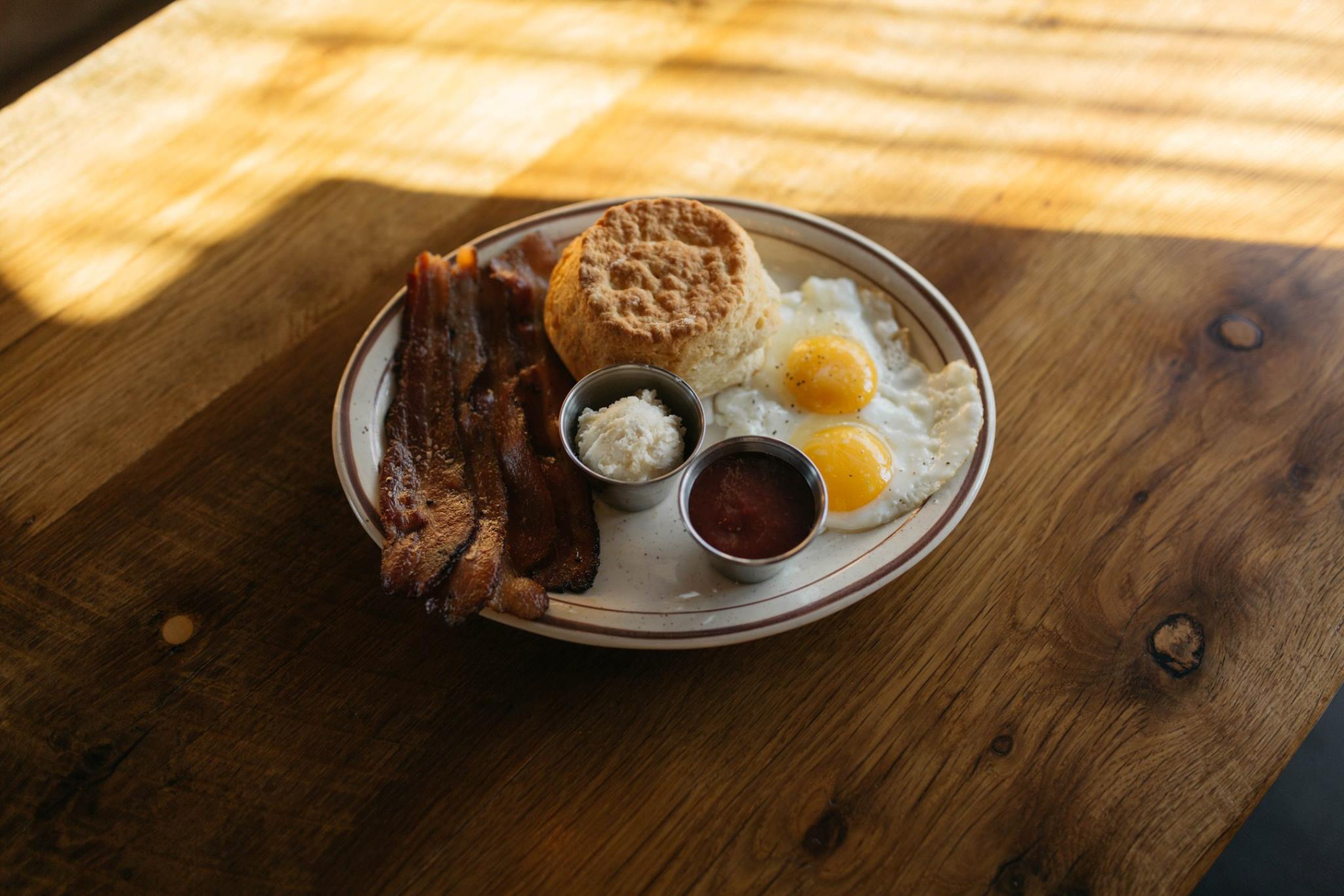 Denver Biscuit Co's bacon, eggs, and biscuit plate