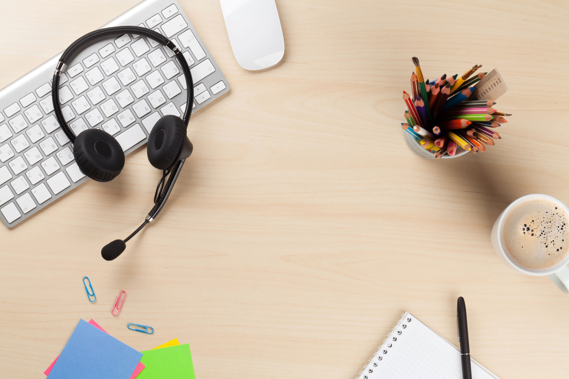 Headset on a keyboard on a work desk