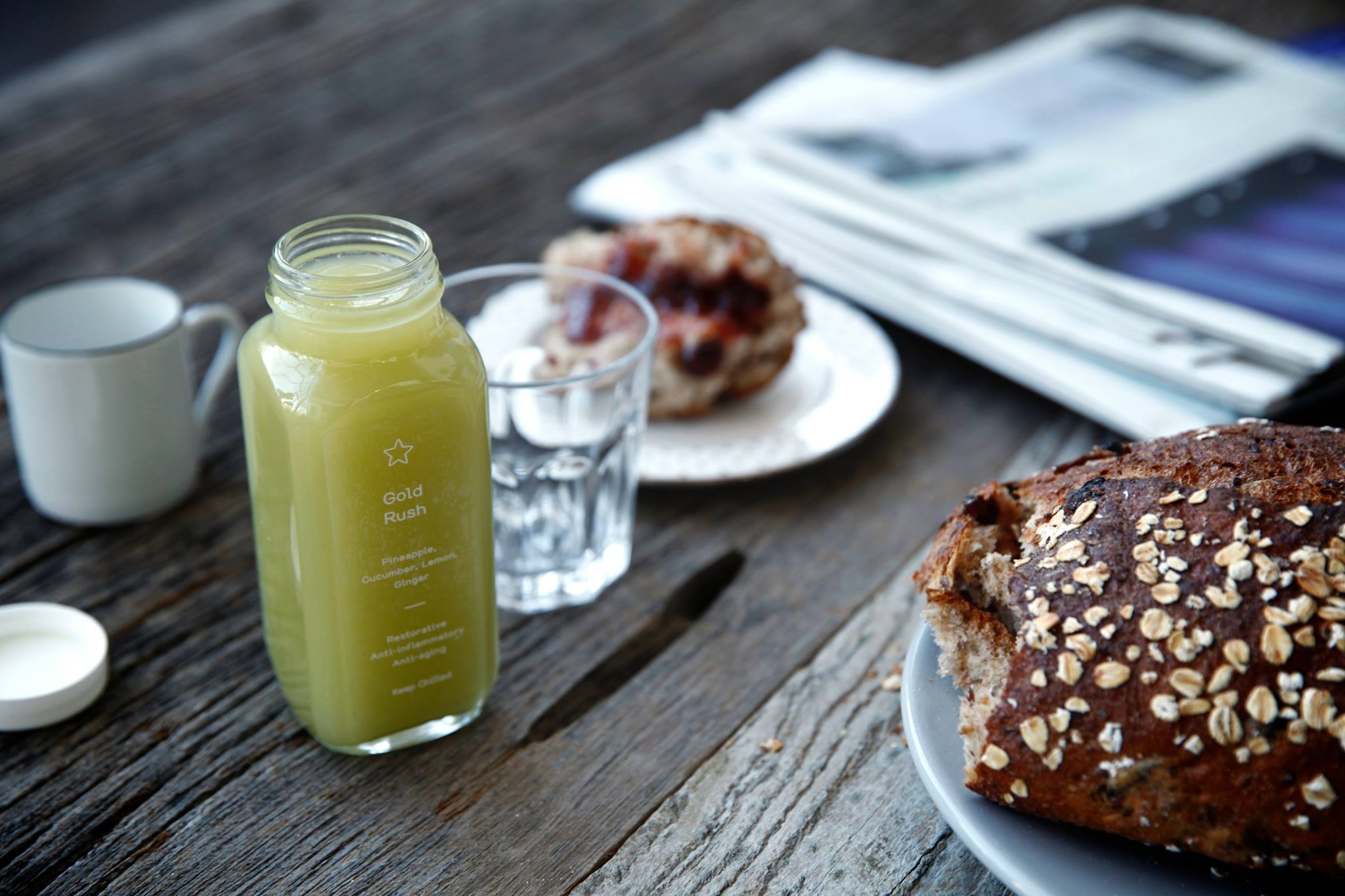 Greenhouse Juice Co's juice and baked goods on a table