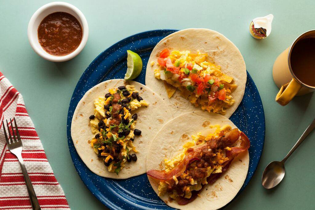 Mi Madre's breakfast tacos on a plate with sides