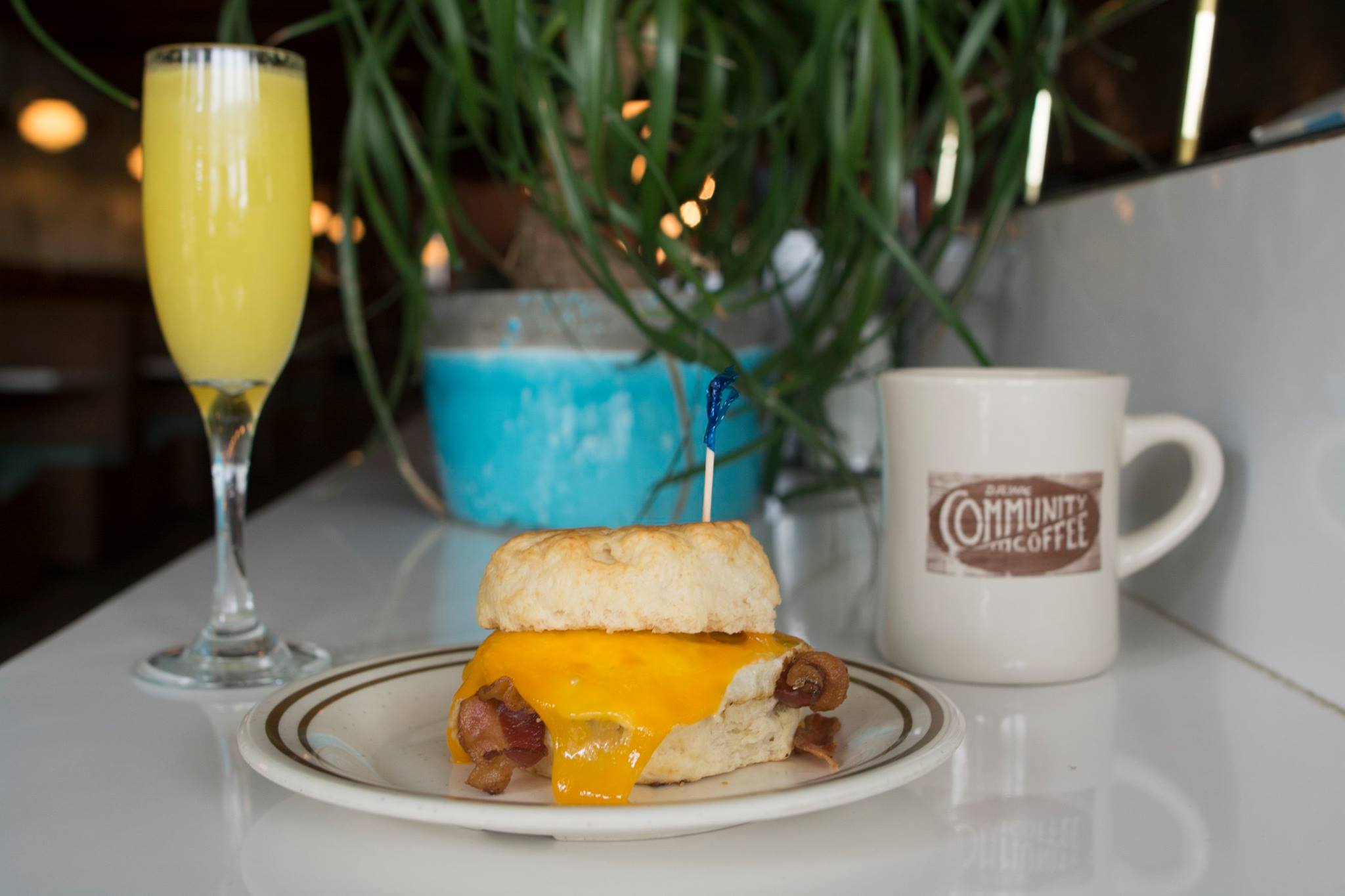Sawyer and Co.'s coffee, mimosa, and breakfast sandwich