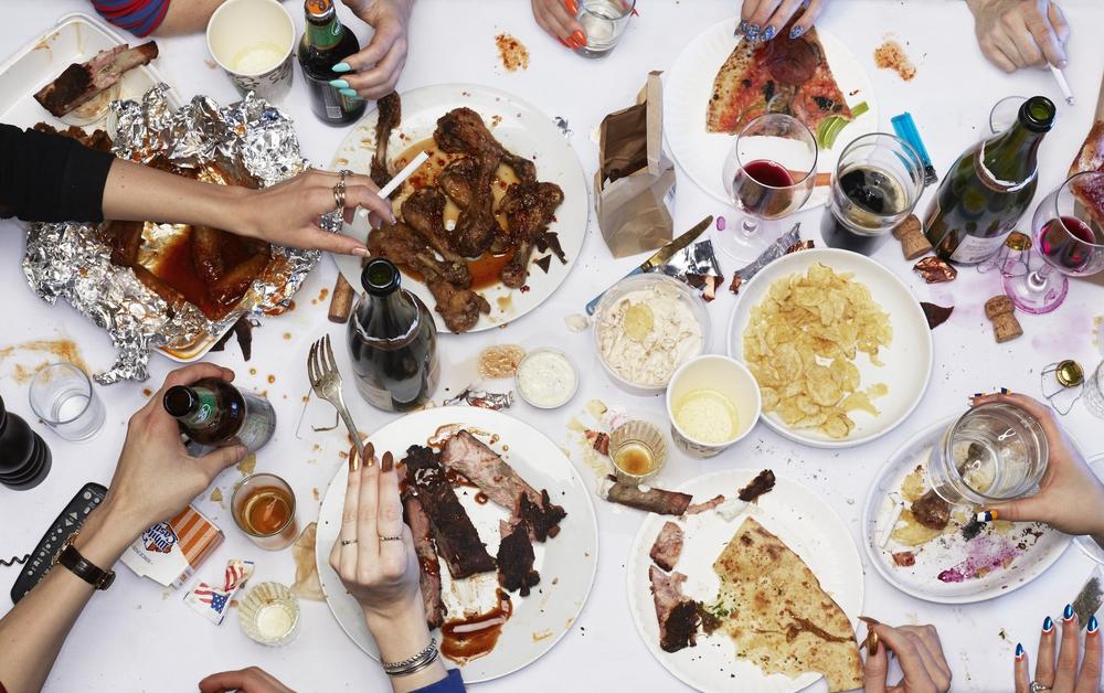 Munchies podcast cover image of a messy table full of snacks and drinks