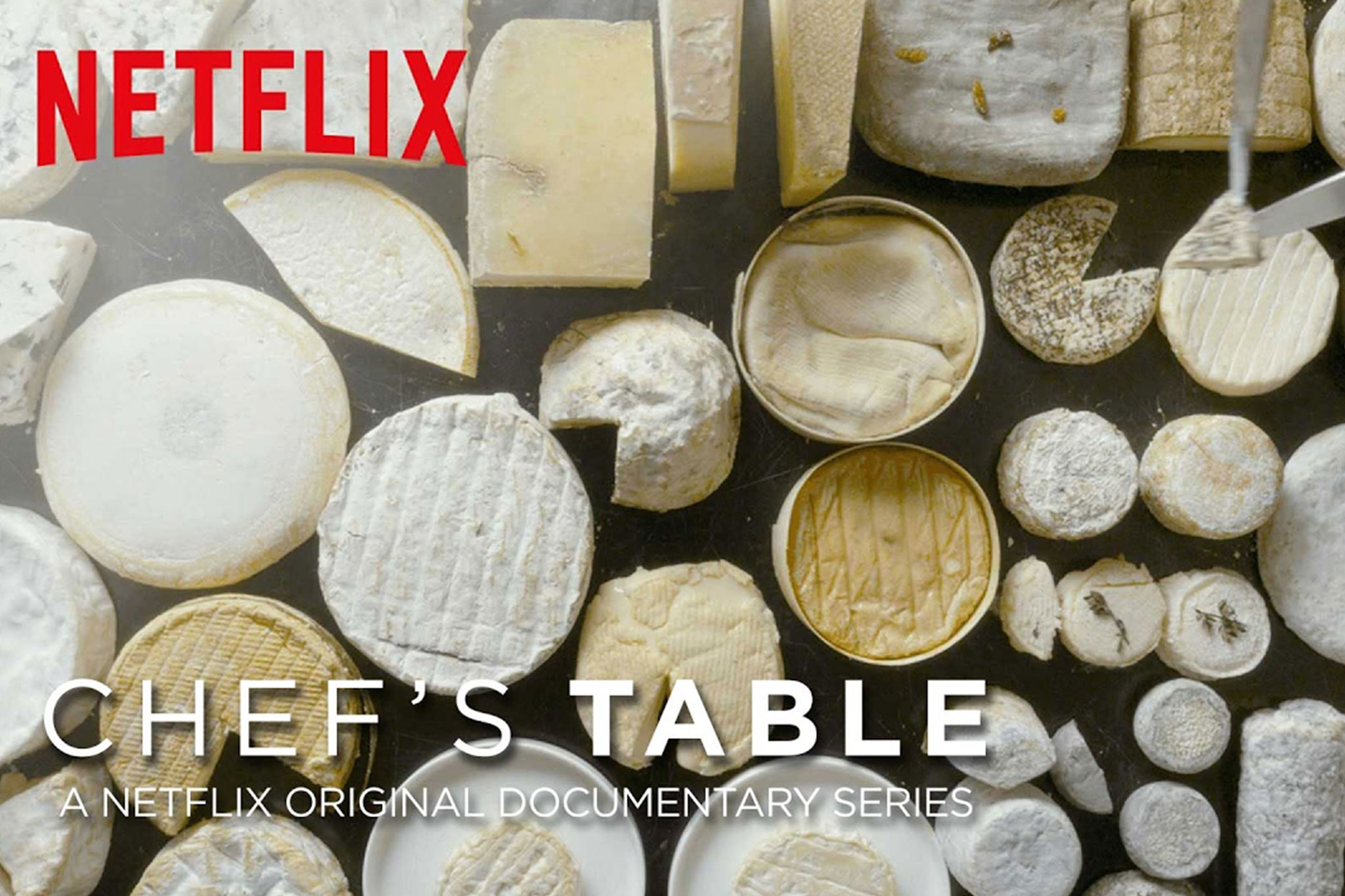 Rounds of different cheeses with the words: Netflix Chef's Table on top