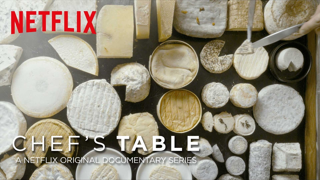 Netflix Chef's Table background with rounds of cheeses