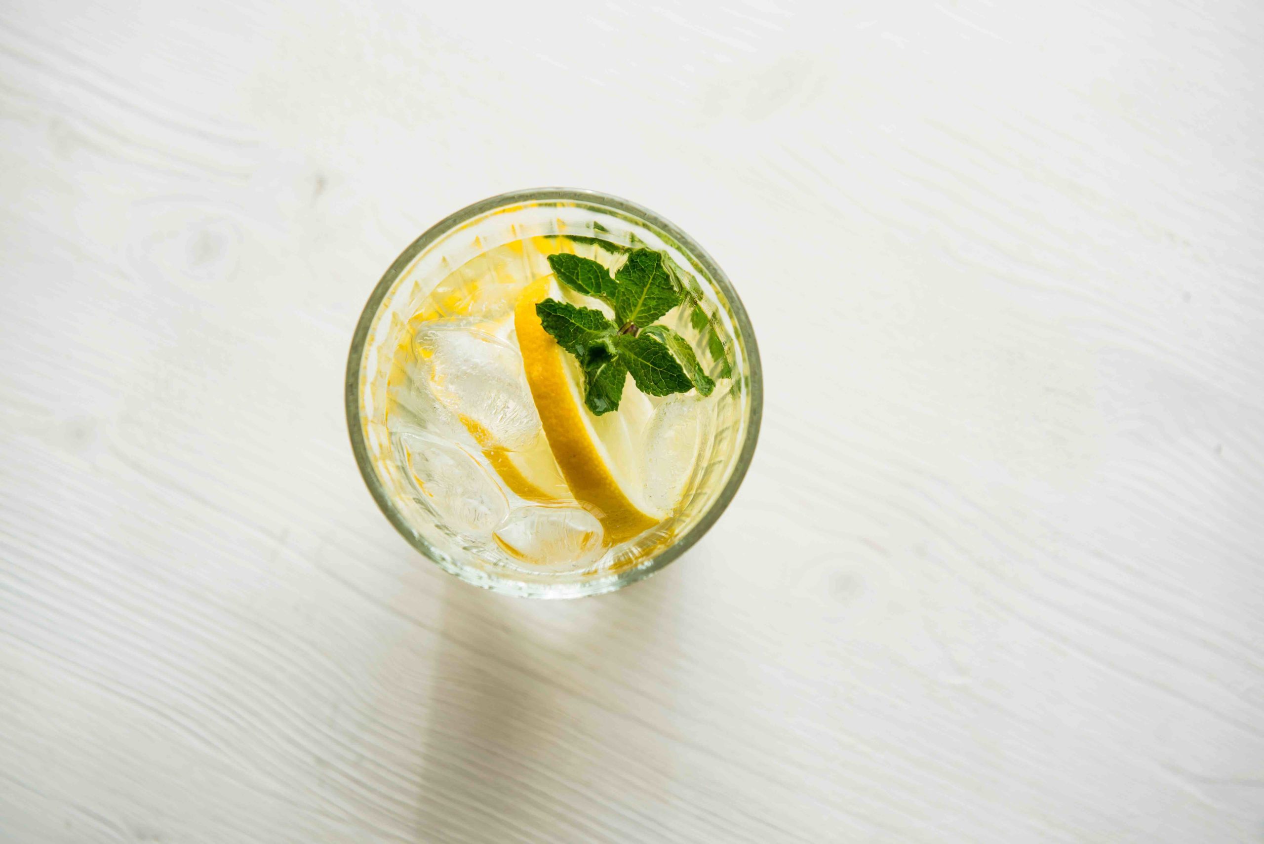 Lemon mint and ice water on a table