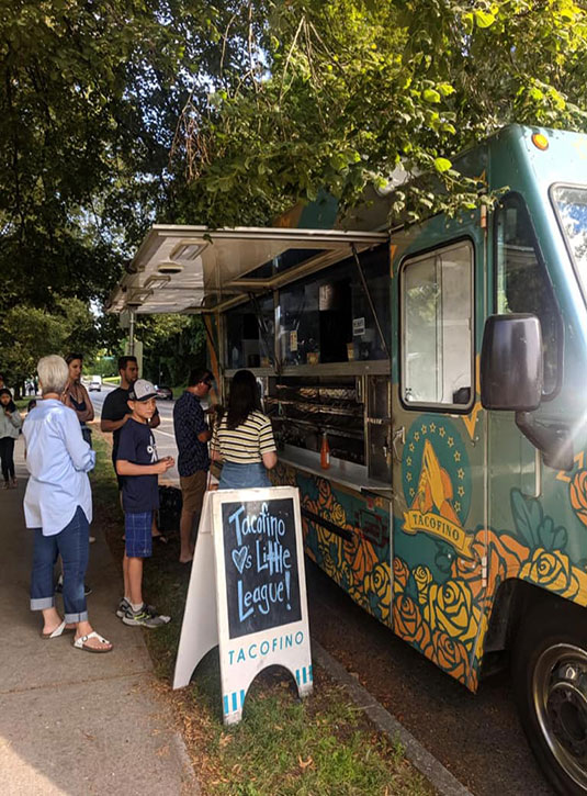 People lined up at the Tacofino food truck outside