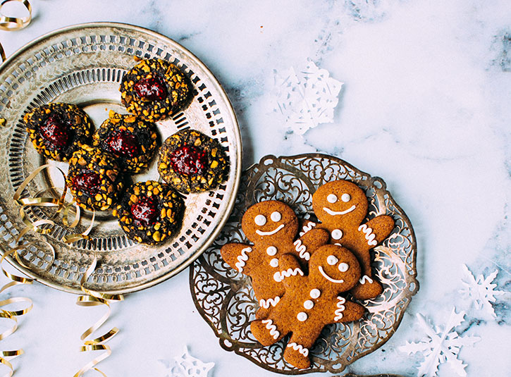 Festive cookies on plates on a wintery marble background