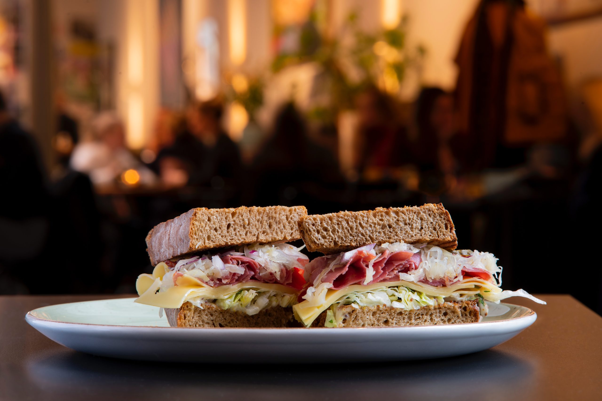 A sandwich on a plate in a restaurant