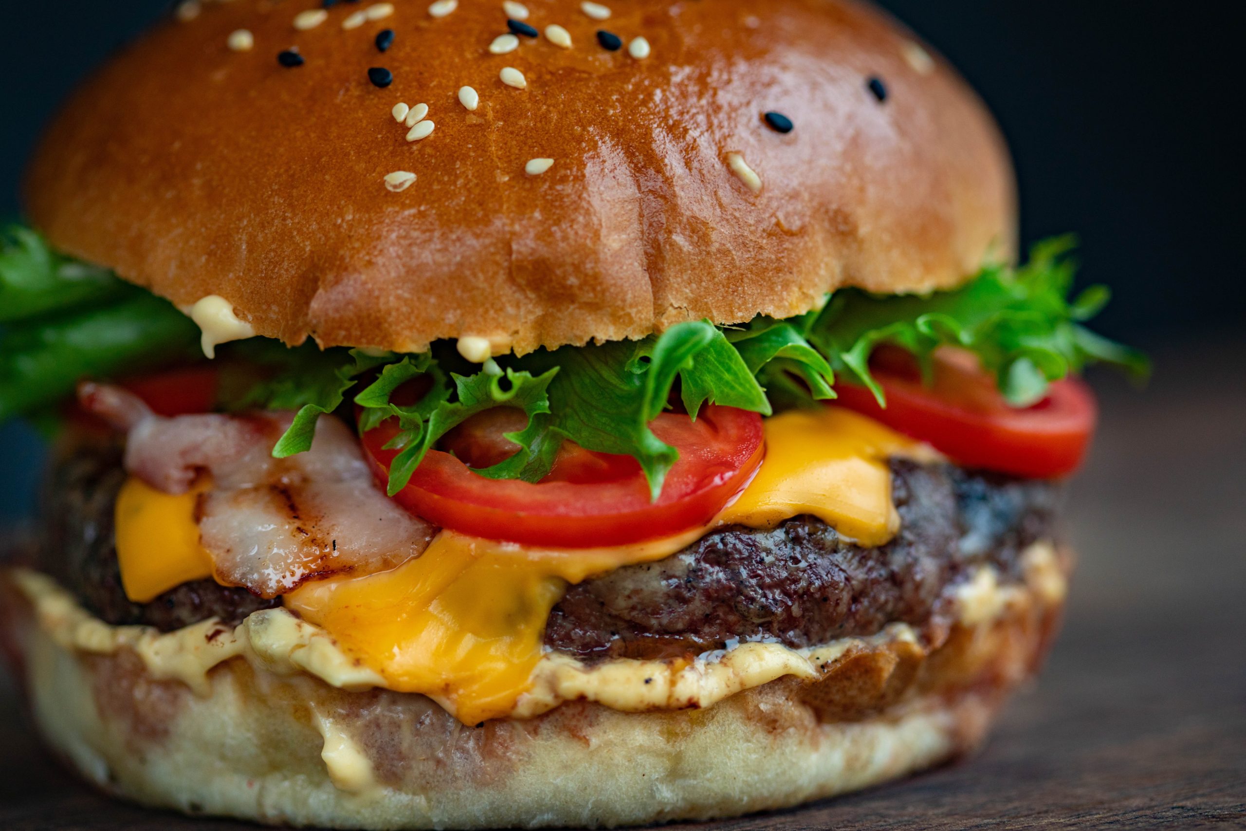 Close-up of a cheeseburger with fixings