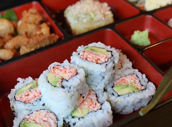 Bento box with sushi rolls