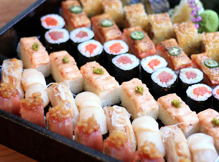 A platter of different kinds of sushi rolls