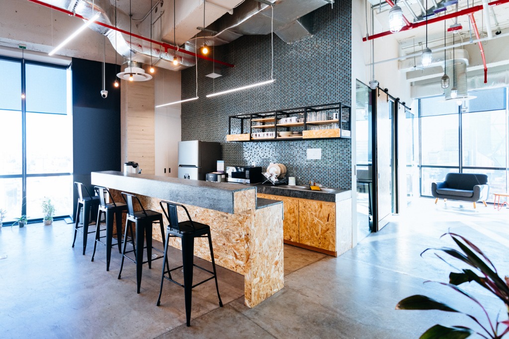 A modern kitchen in an open concept office space
