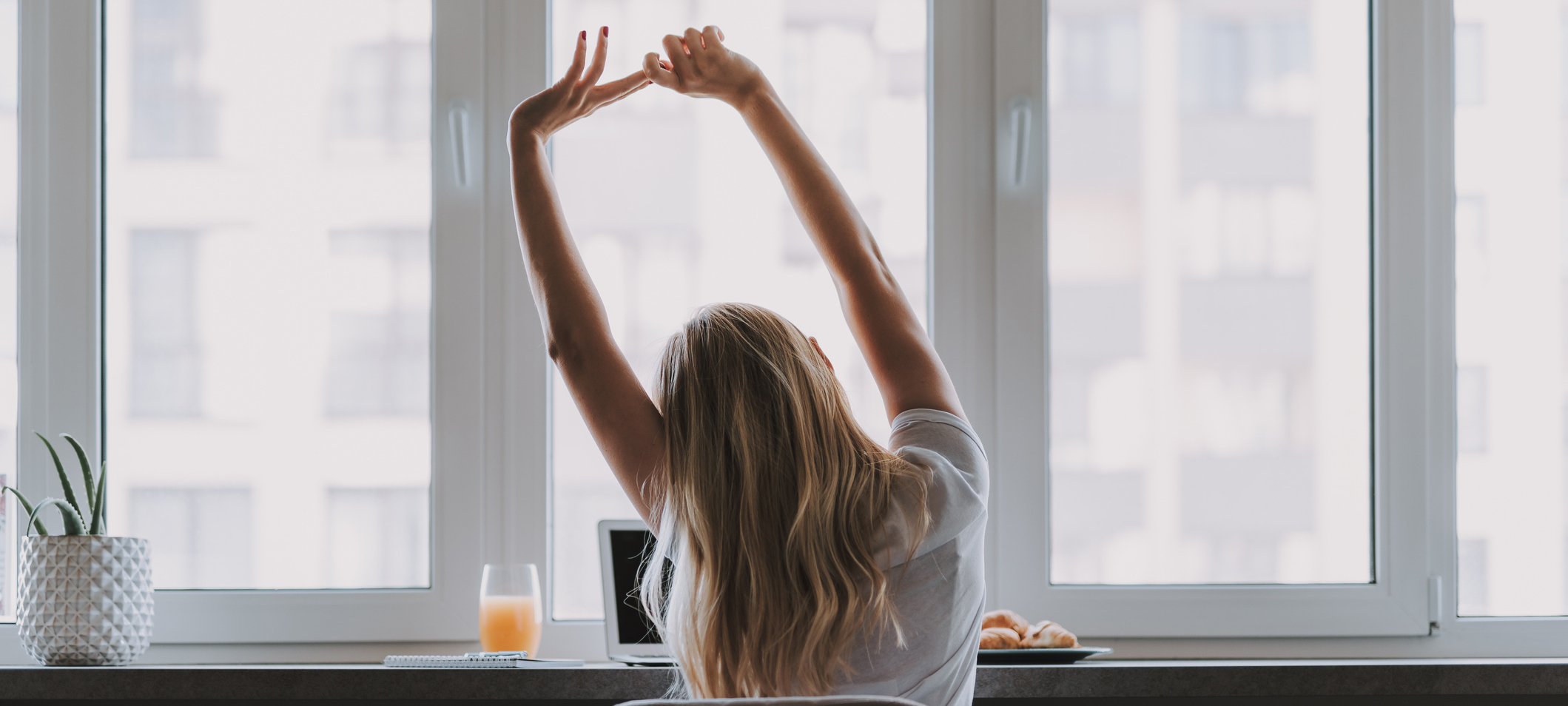 A woman stretching in the office