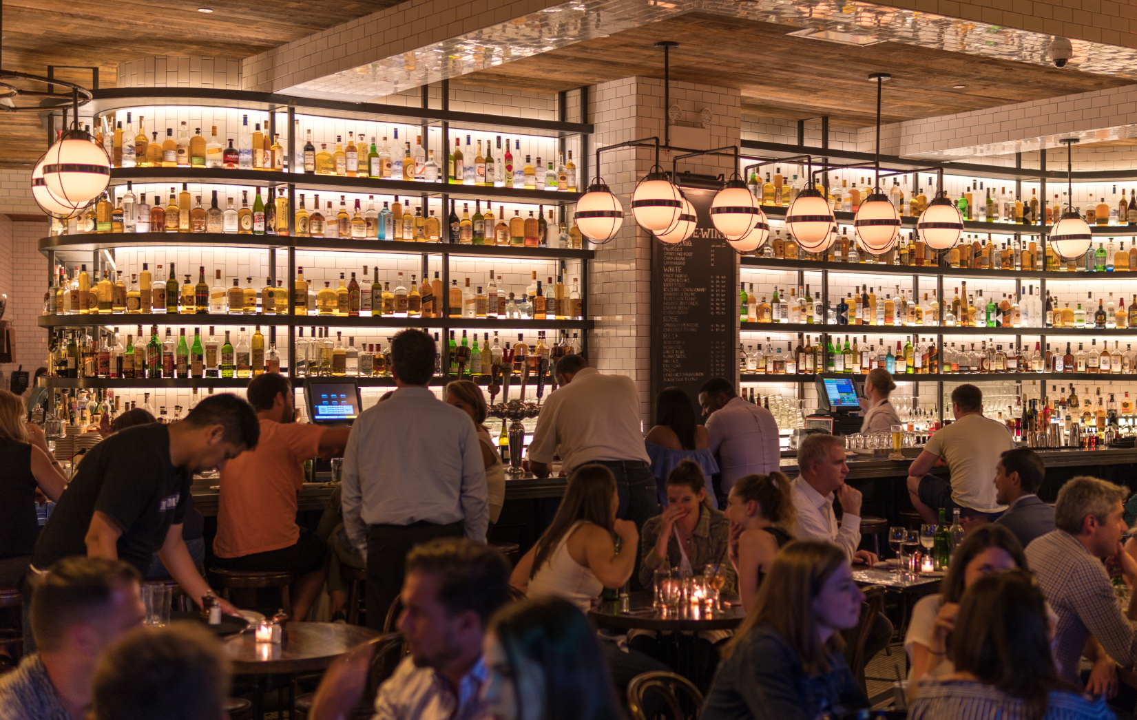 A packed restaurant at night