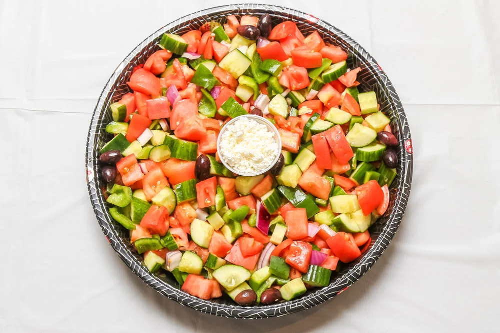 A large circular platter of the Tabbouleh Salad.