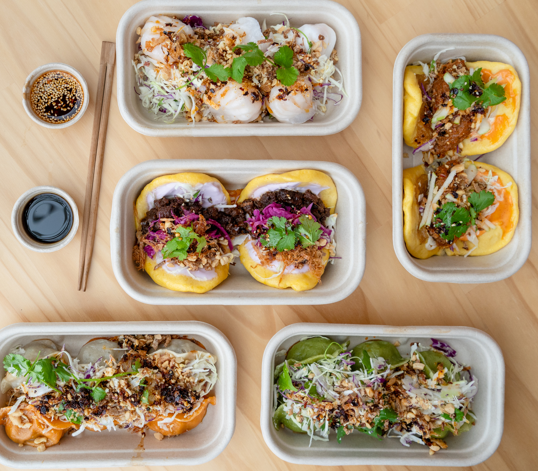 Various dishes in compostable packaging