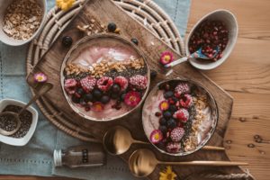 Smoothie, fruit, granola, and yogurt healthy bowls
