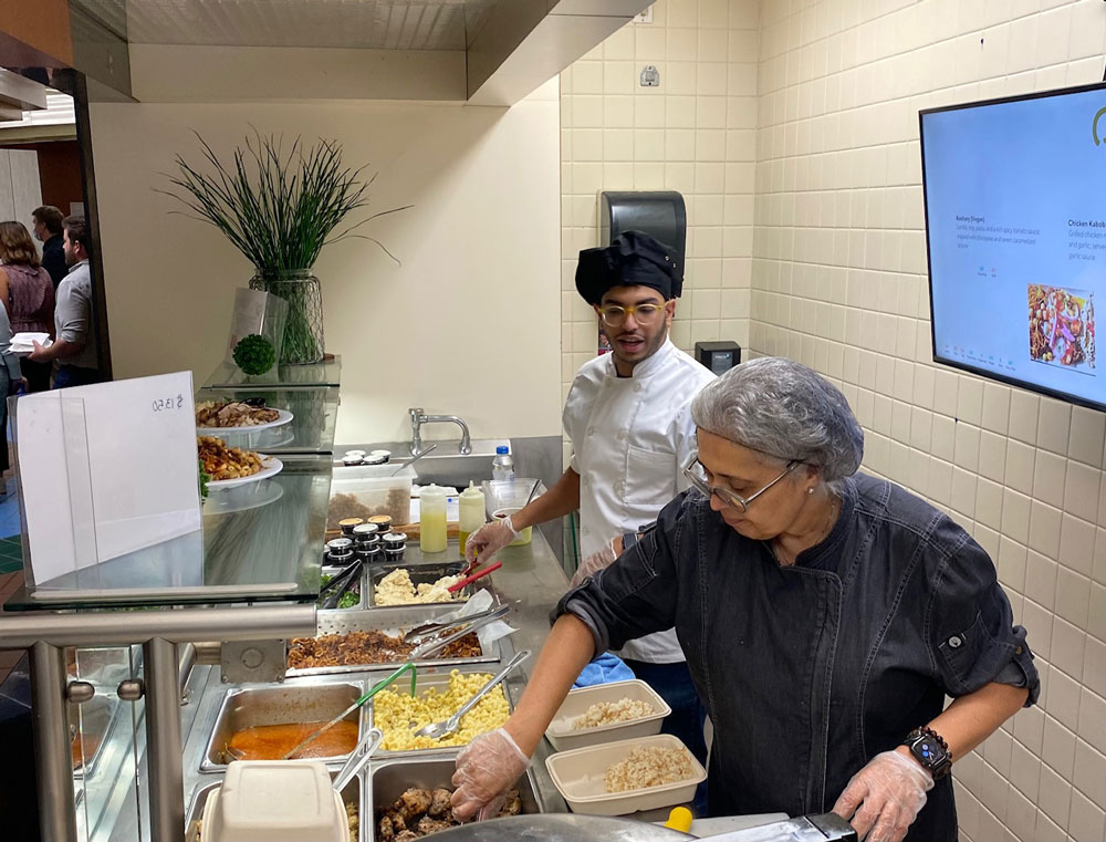 FavaPot restaurant food servers preparing dishes for customers.