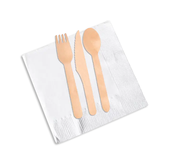 A compostable wooden fork, knife, and spoon on a white napkin.